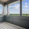 Private balcony with city views and outdoor seating at The Birney Apartments