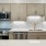 Contemporary kitchen with stainless steel appliances and quartz countertops at The Birney Apartments