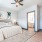 bedroom with bed and wall art