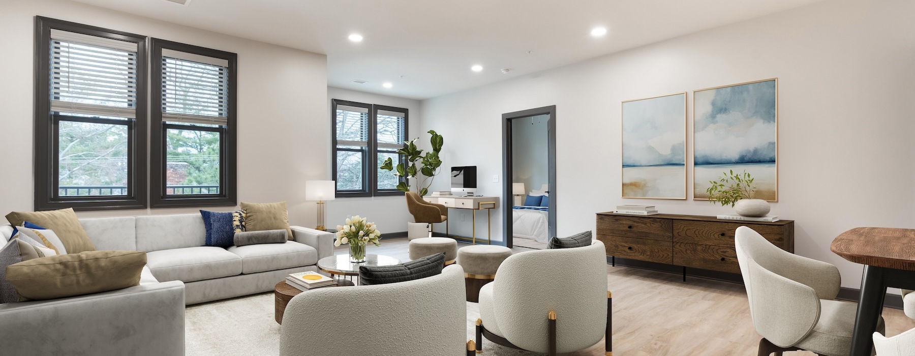 living room with couch coffee table and windows