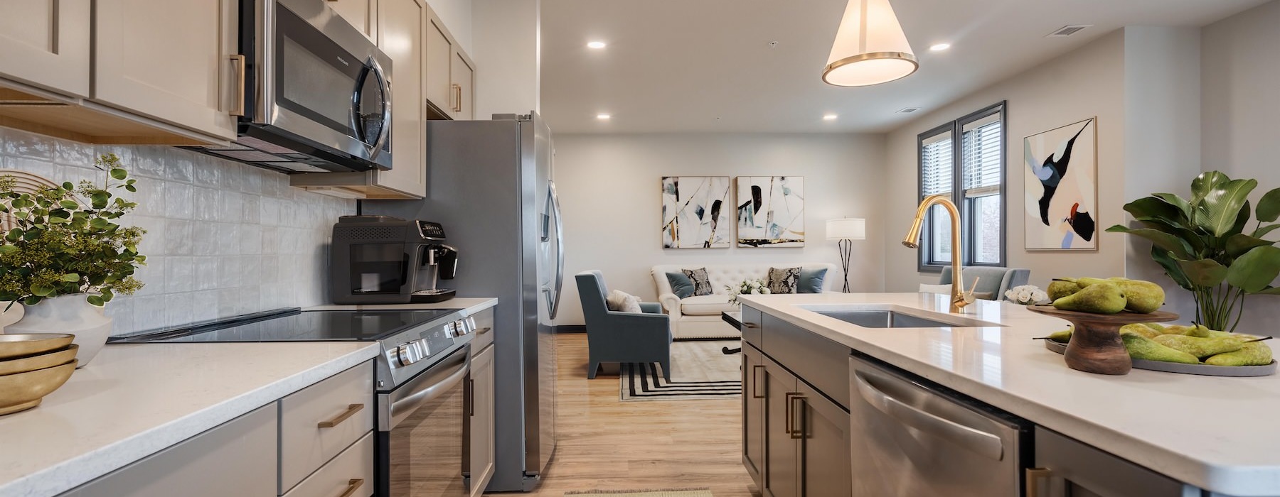 kitchen with beige cabinets and stainless steel appliances
